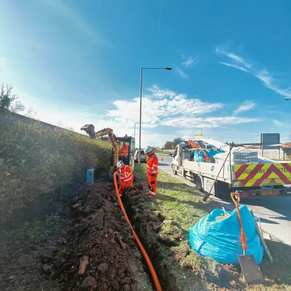 Construction workers digging underground groundworks.