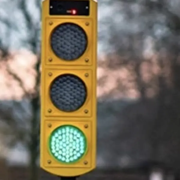 Traffic signal head showing green.