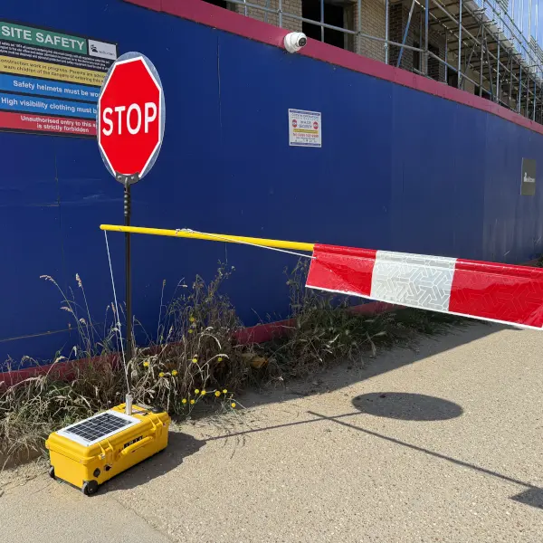 solar powered stop/go with flagger arm barrier attached.